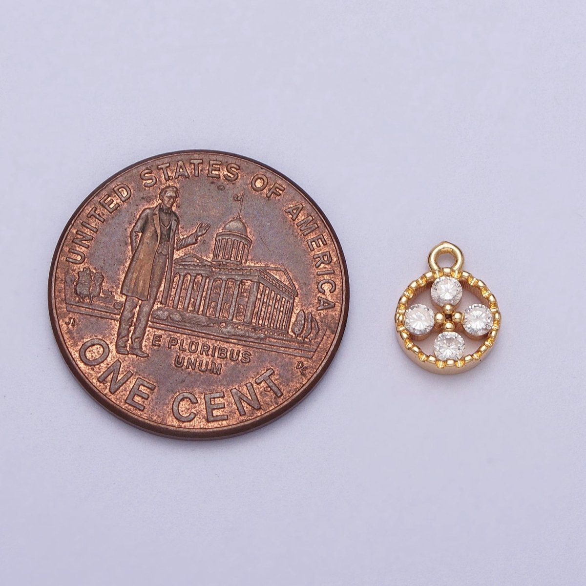 Mini Clear Cubic Zirconia Quatrefoil Open Round Gold Charm E-512
