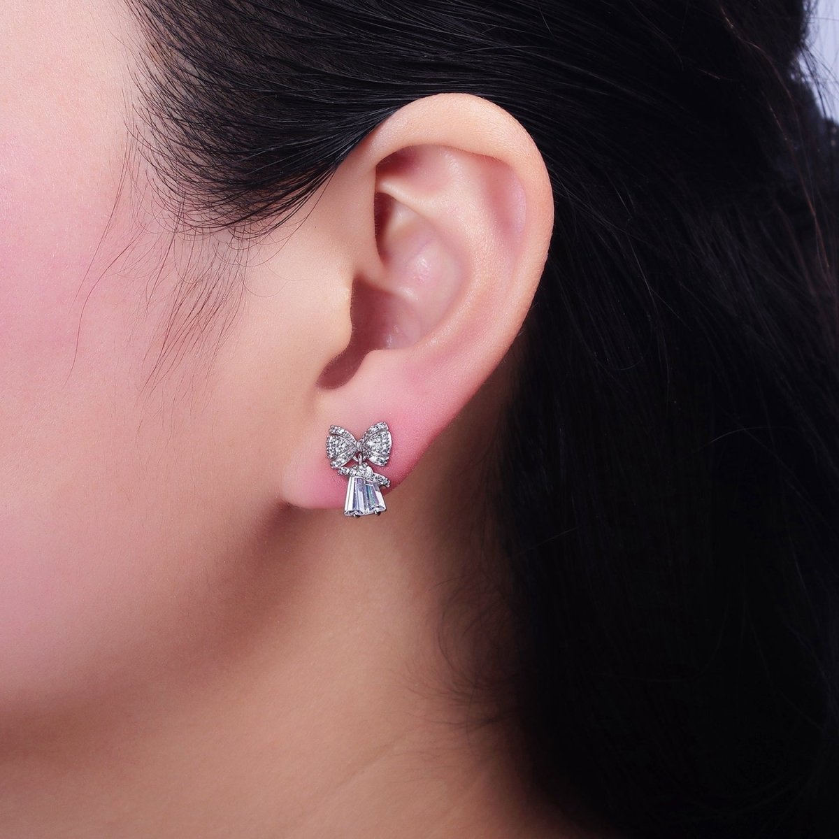 White Gold Filled Micro Paved CZ Ribbon Clear Baguette Bell Stud Earrings | AD1454